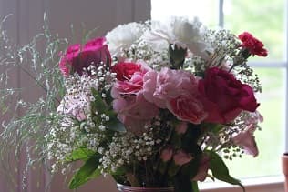 Flower arrangement pink white red flowers with baby's breath